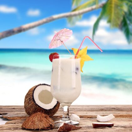 Tropical drink with coconut on the beach