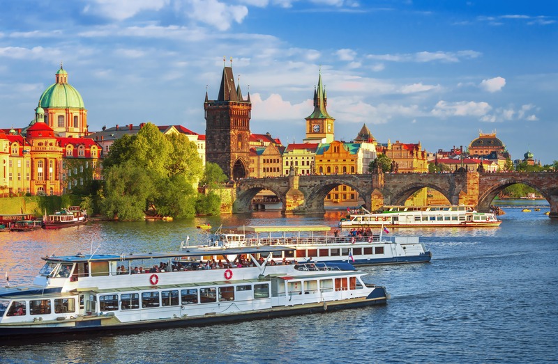 Cruise ships on the Vltava River near the Charles Bridge in Prague